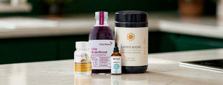 Supplement bottles on a kitchen counter with blurred background.