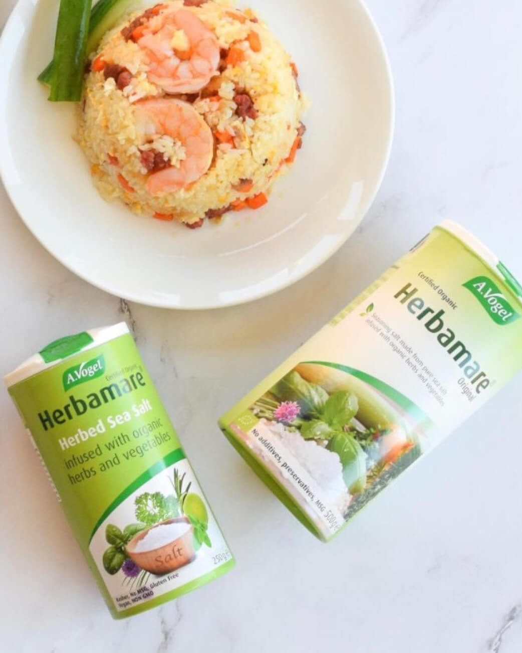 Herbamare salt packaging with a dish of food in the background