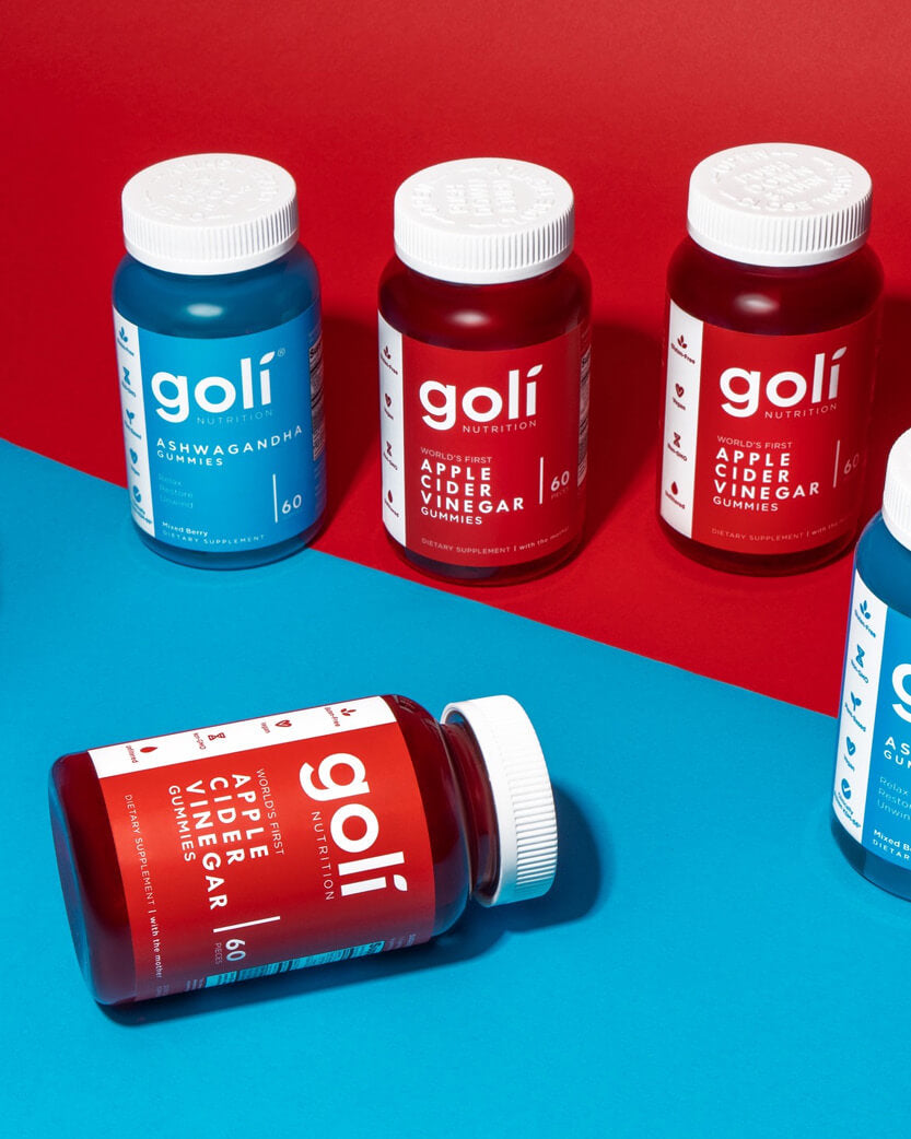Goli supplement bottles on a red and blue background.