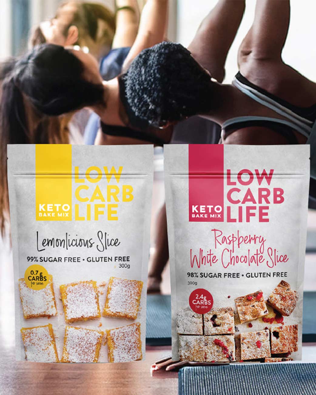 Two packages of 'Low Carb Life' keto bake mix with people exercising in the background.