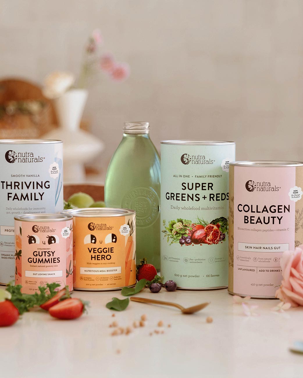Collection of Nutra Naturals products on a table with a neutral background
