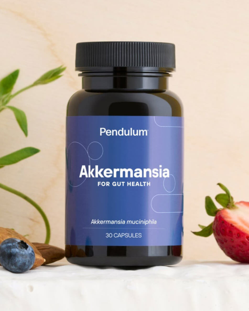 Bottle of Pendulum Akkermansia supplement with a blue label on a light background.