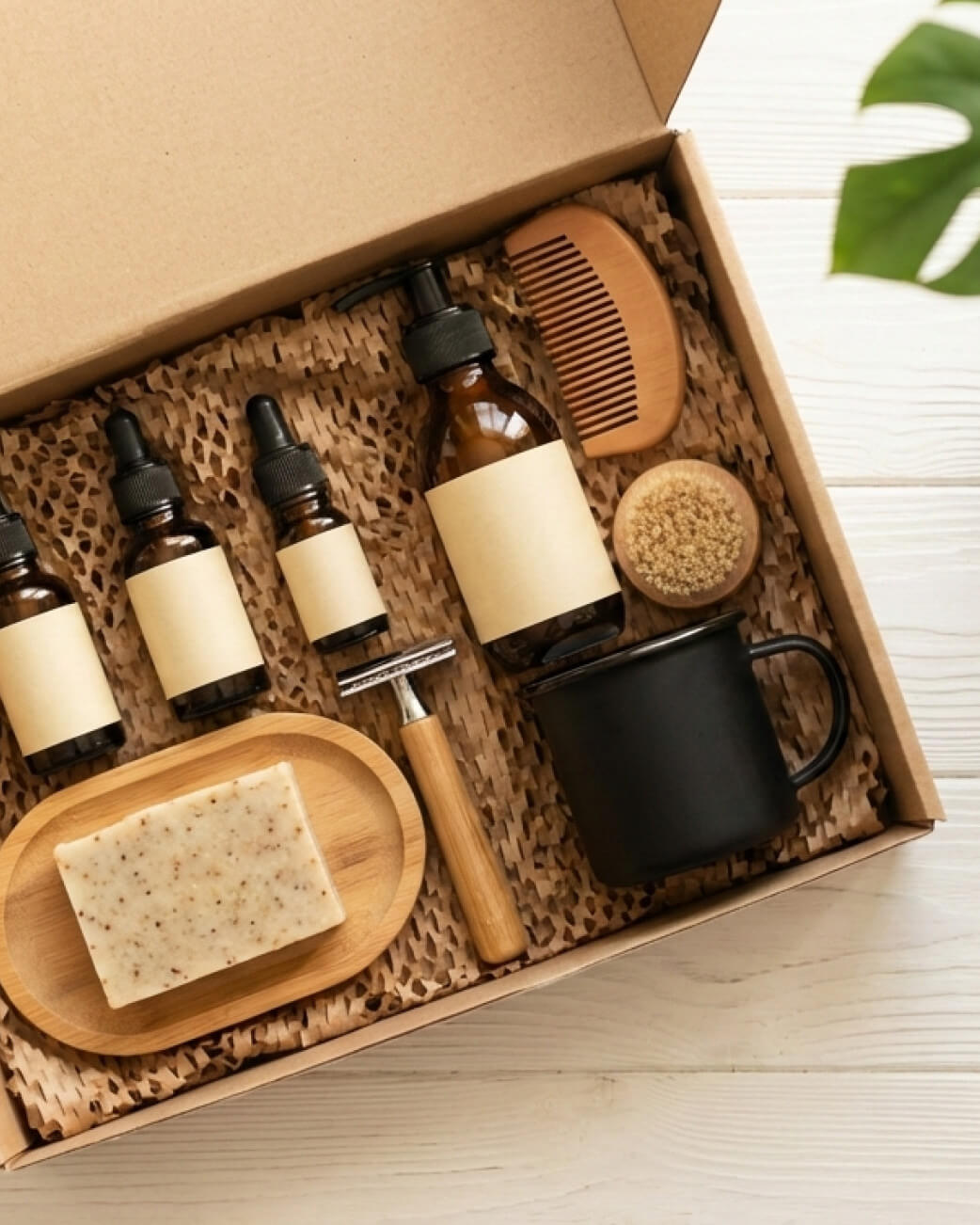 Grooming kit with bottles, a comb, mug, and soap in a cardboard box.