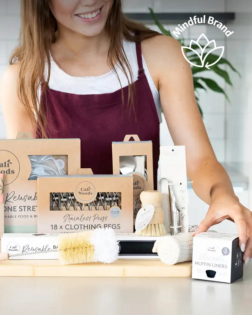 Person in a kitchen setting with 'Mindful Brand' logo, displaying products on a counter.