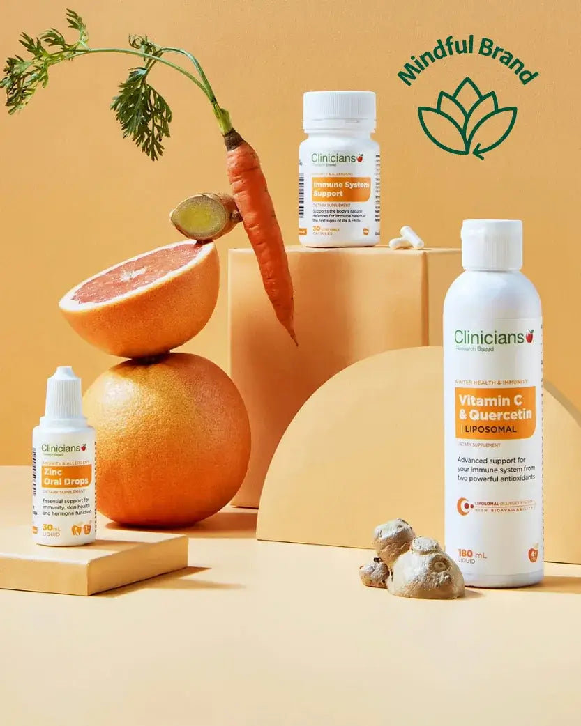 Vitamins and supplements with fruits and vegetables on a neutral background, featuring the Mindful Brand logo.