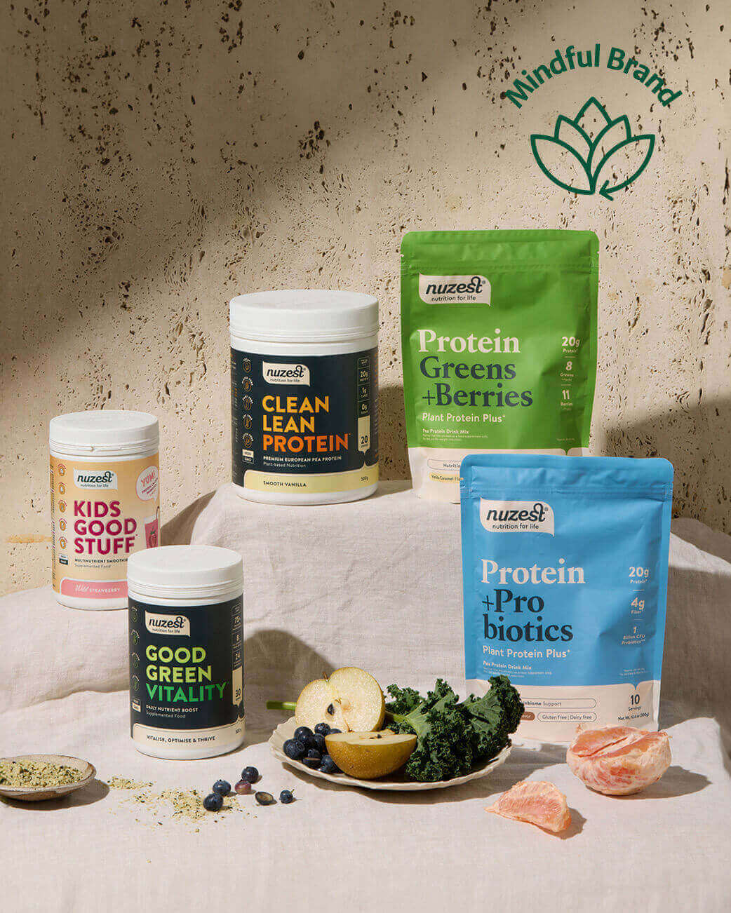 Nuzest health products including protein powders and greens on a textured surface with 'Mindful Brand' logo.