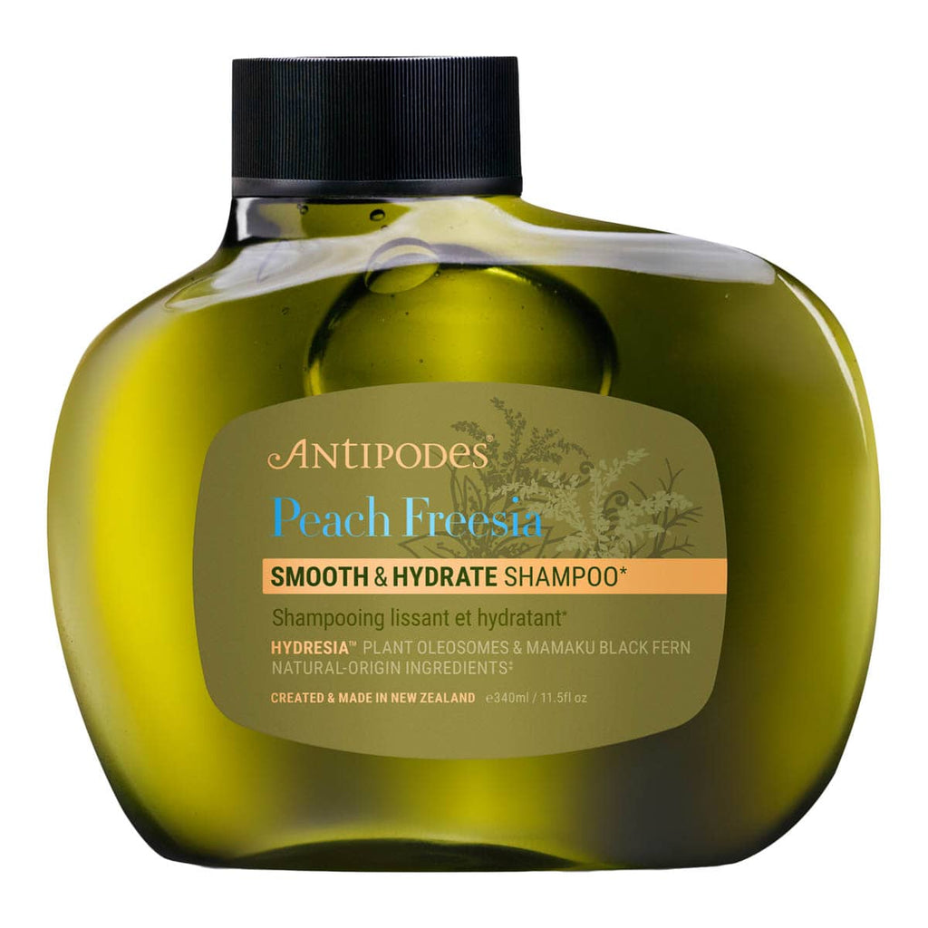 Antipodes Peach Freesia shampoo bottle on a white background.