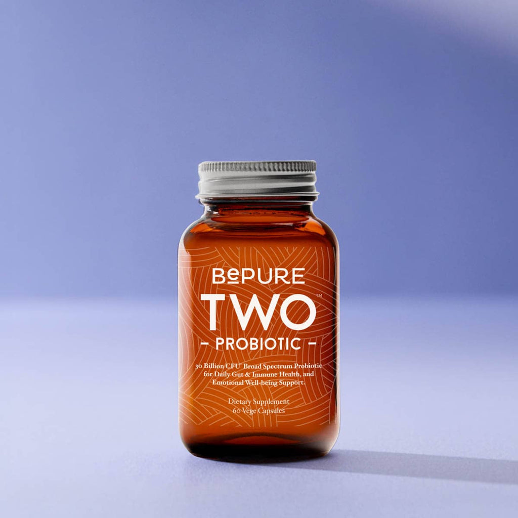 Bottle of BePure Two Probiotic on a gradient blue background