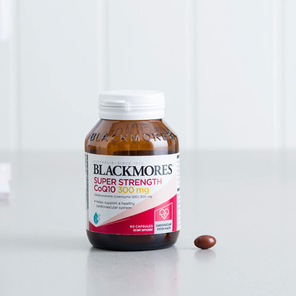 Blackmores Super Strength CoQ10 supplement bottle on a white surface.