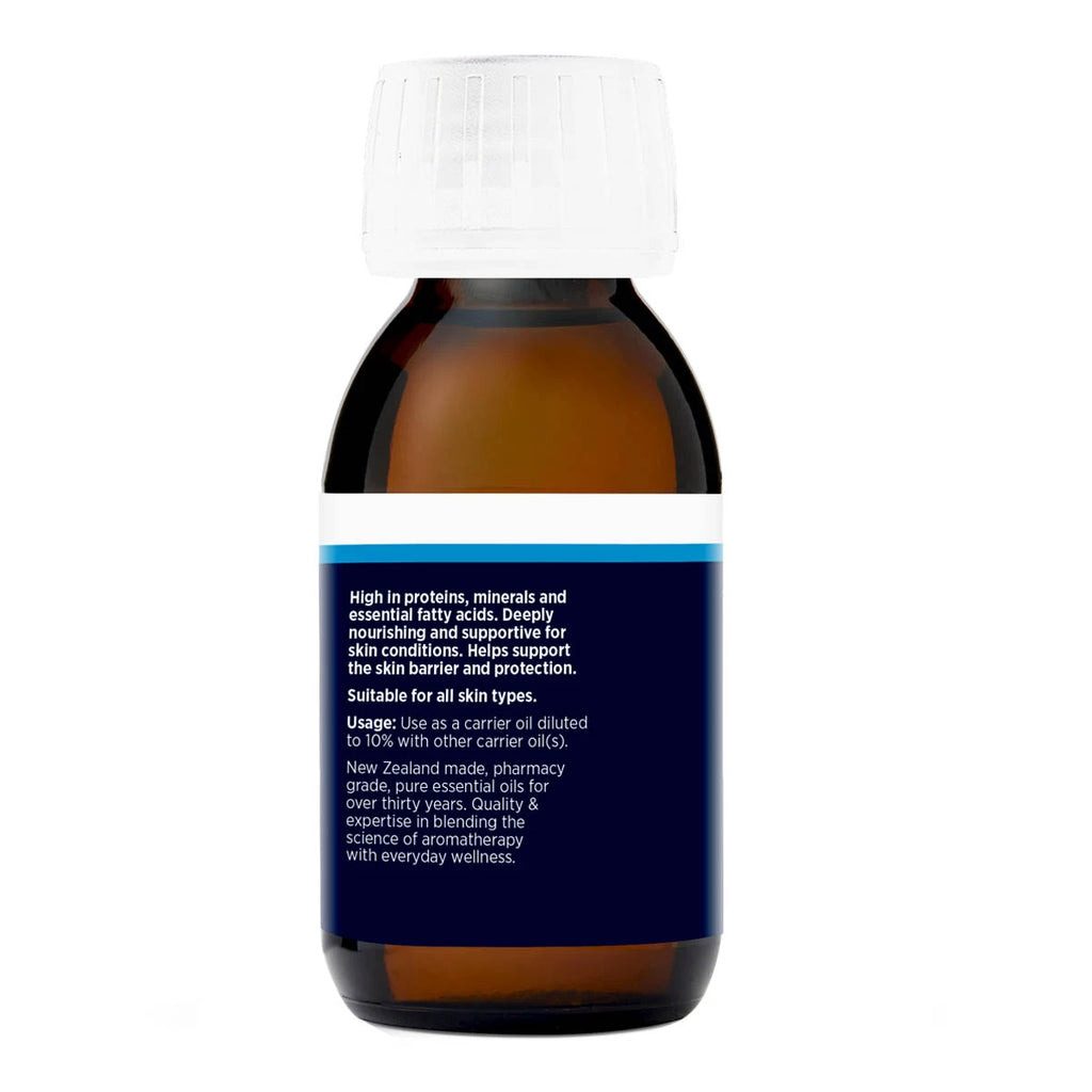Amber glass bottle of wheatgerm oil showing label with usage instructions and product information.