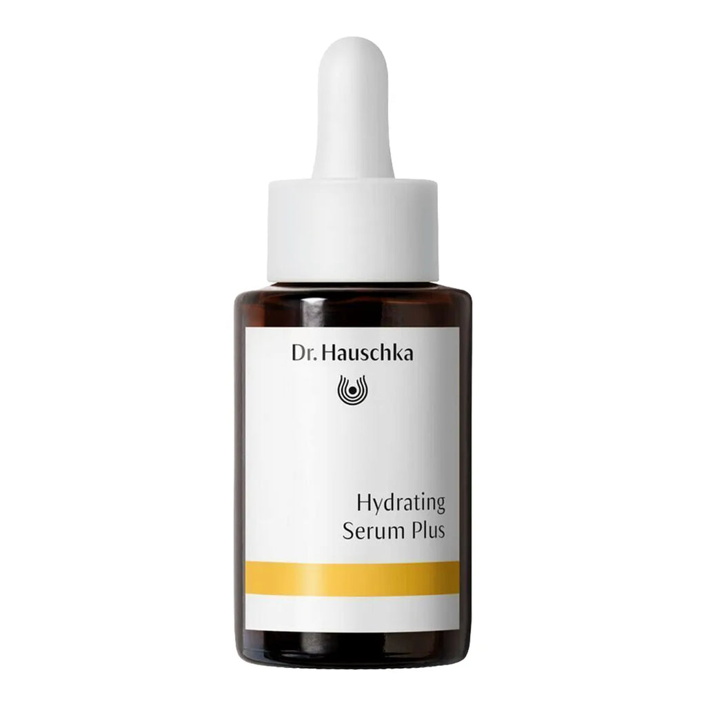 Dr. Hauschka Hydrating Serum Plus in an amber glass dropper bottle with a white label and white dropper cap, isolated on a white background.