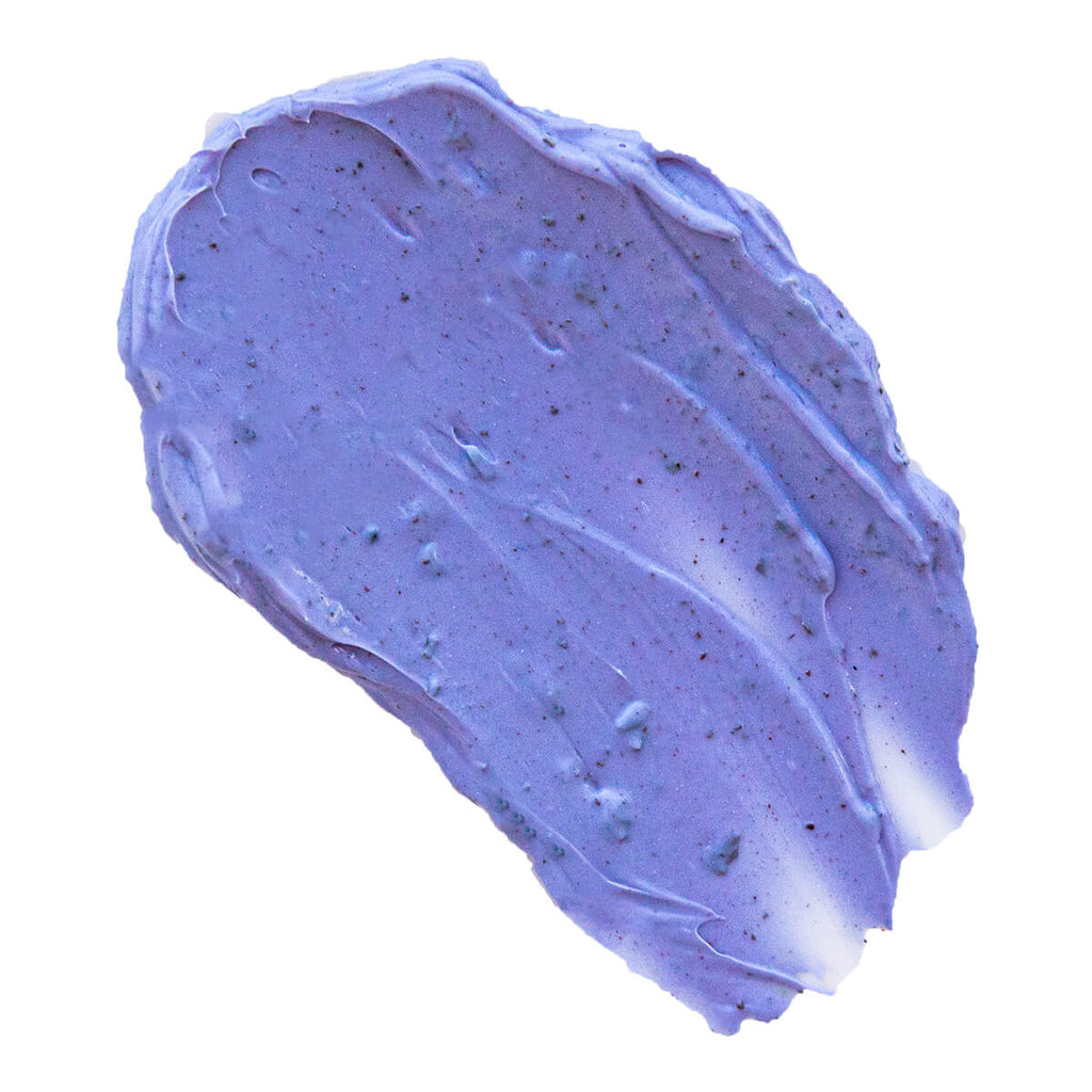 Purple cream texture with specks on a white background.