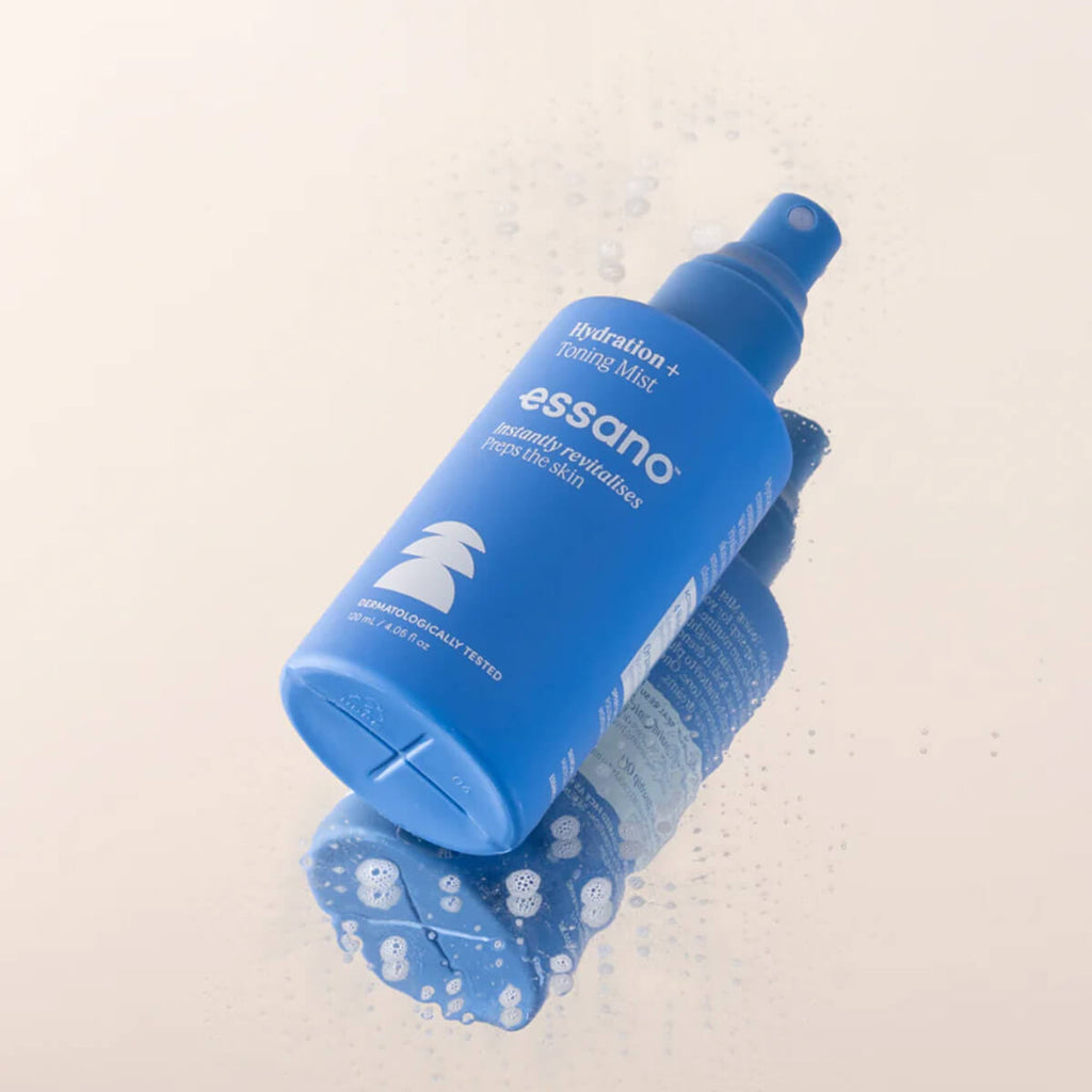 Blue bottle of essano product on a light beige background.