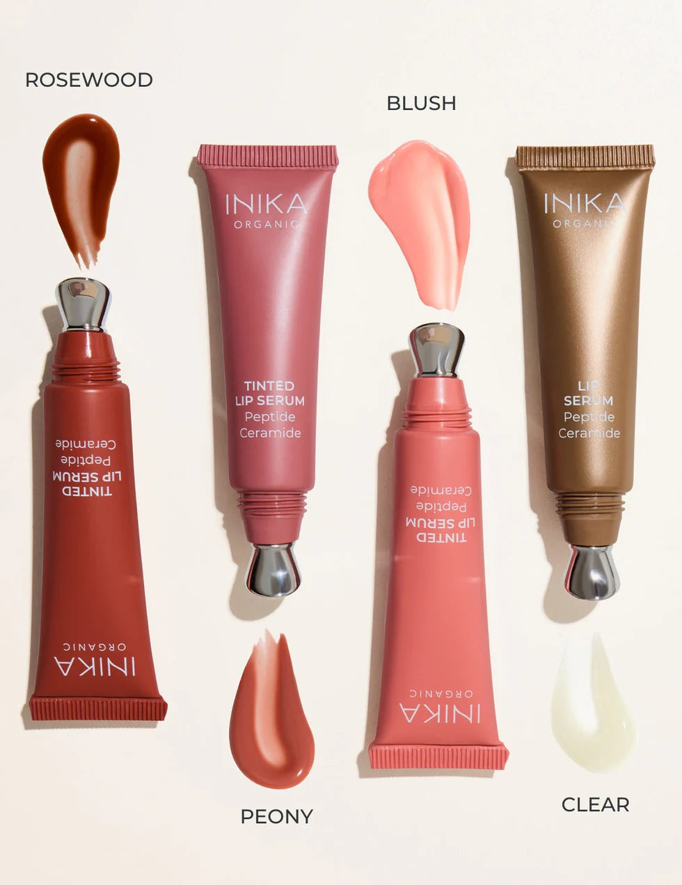 INIKA lip serum products with color swatches on a white background