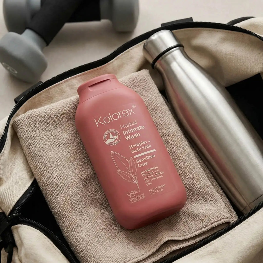 Kolarex Herbal Intimate Wash bottle on a towel with a thermos and dumbbells in the background