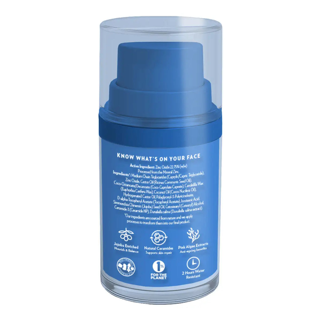 A blue pump bottle of face sunscreen inside a clear cylindrical protective case, shown against a plain white background.