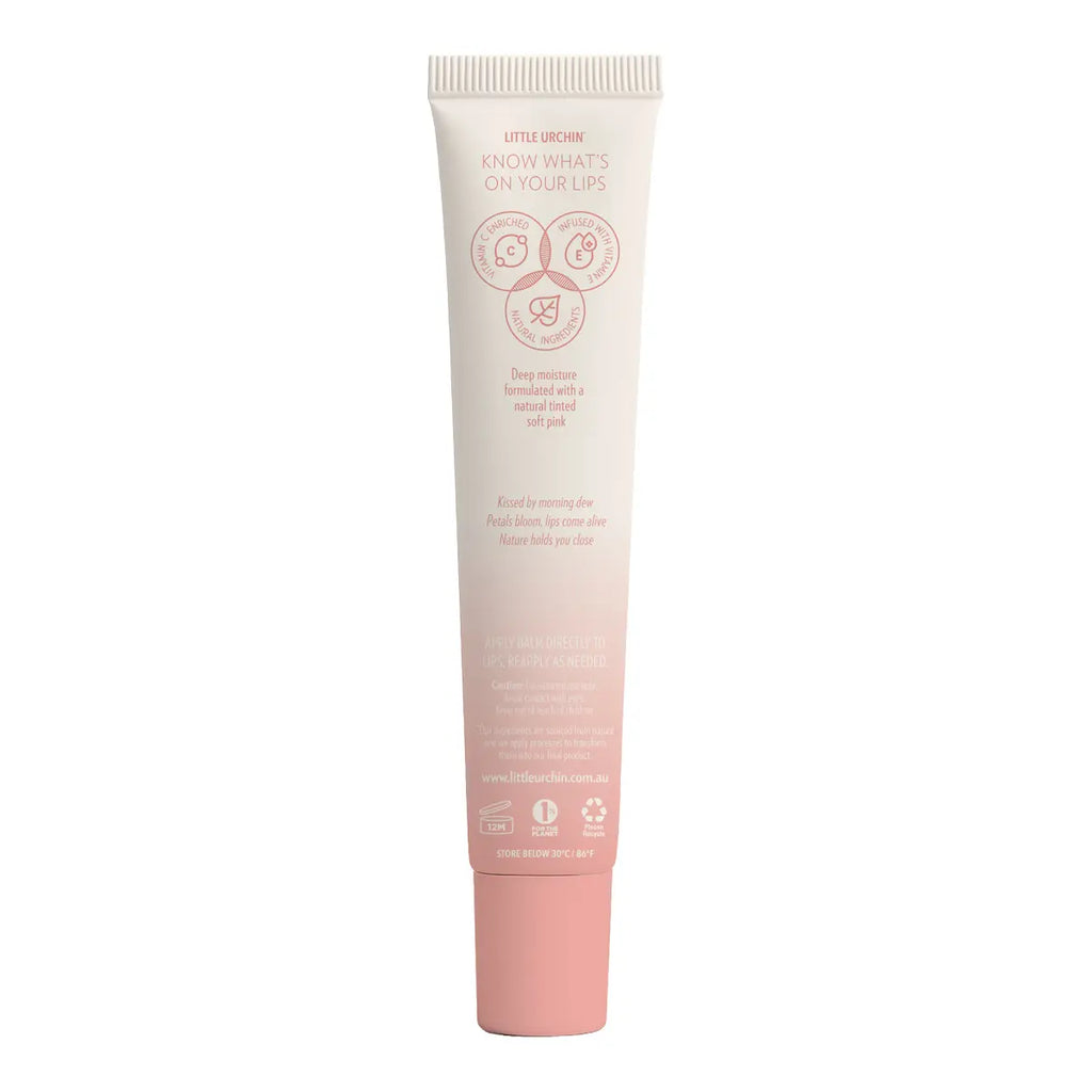 Back of tube of watermelon lip balm, showing icons and pink text on a gradient.