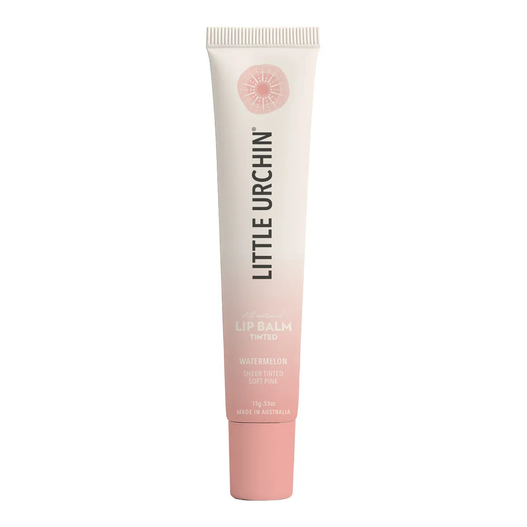 A tube of Little Urchin Lip Balm in the Watermelon shade, featuring a white-to-pale-pink gradient tube with a solid pink cap, set against a plain white background.