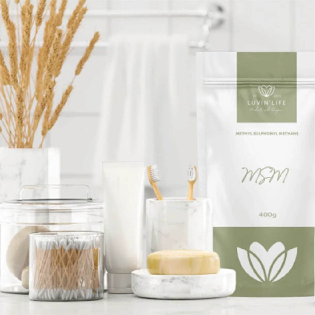 Bathroom setting with toothbrushes, soap, and a package labeled 'LUVIN LIFE' on a white background.