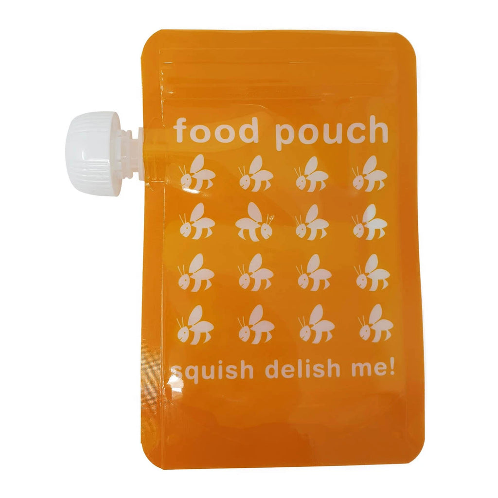 Close up of a single resealable food pouch with twist cap. Warm yellow colour with buzzy bee design and the words: "squish delish me!"