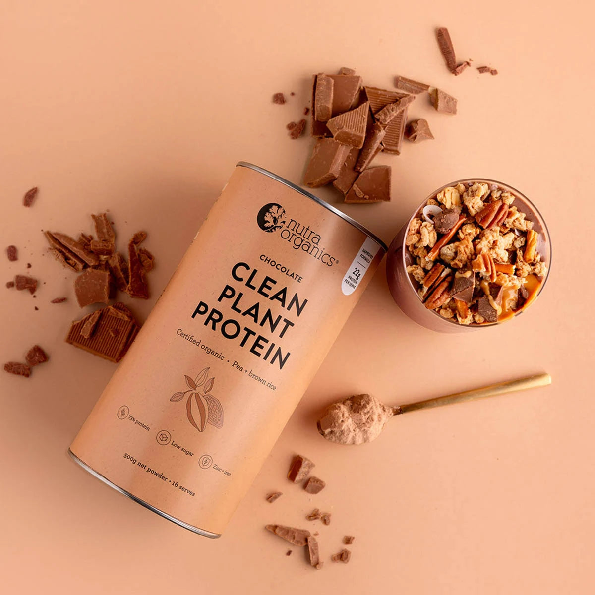 Nutra Organics Clean Plant Protein - Smooth Chocolate on a beige background with smoothie and chocolate pieces.
