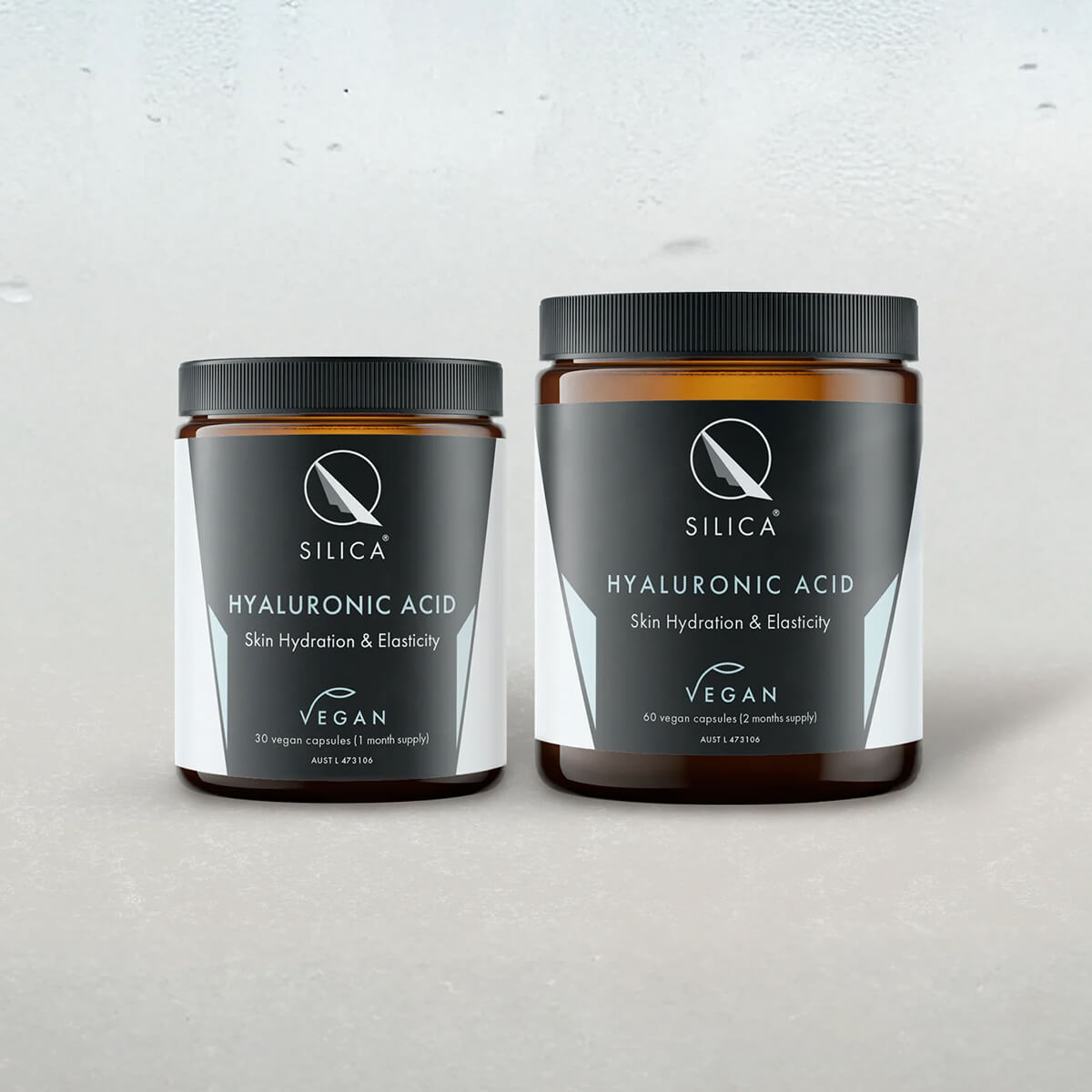 Two jars of Qsilica Hyaluronic Acid supplement on a light grey background.