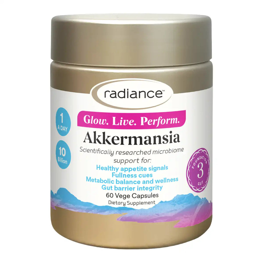 A jar of Radiance Akkermansia dietary supplement, featuring a metallic gold container with a white and pink label.