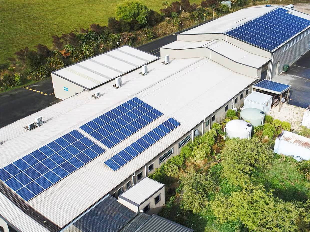 Building with solar panels on the roof.