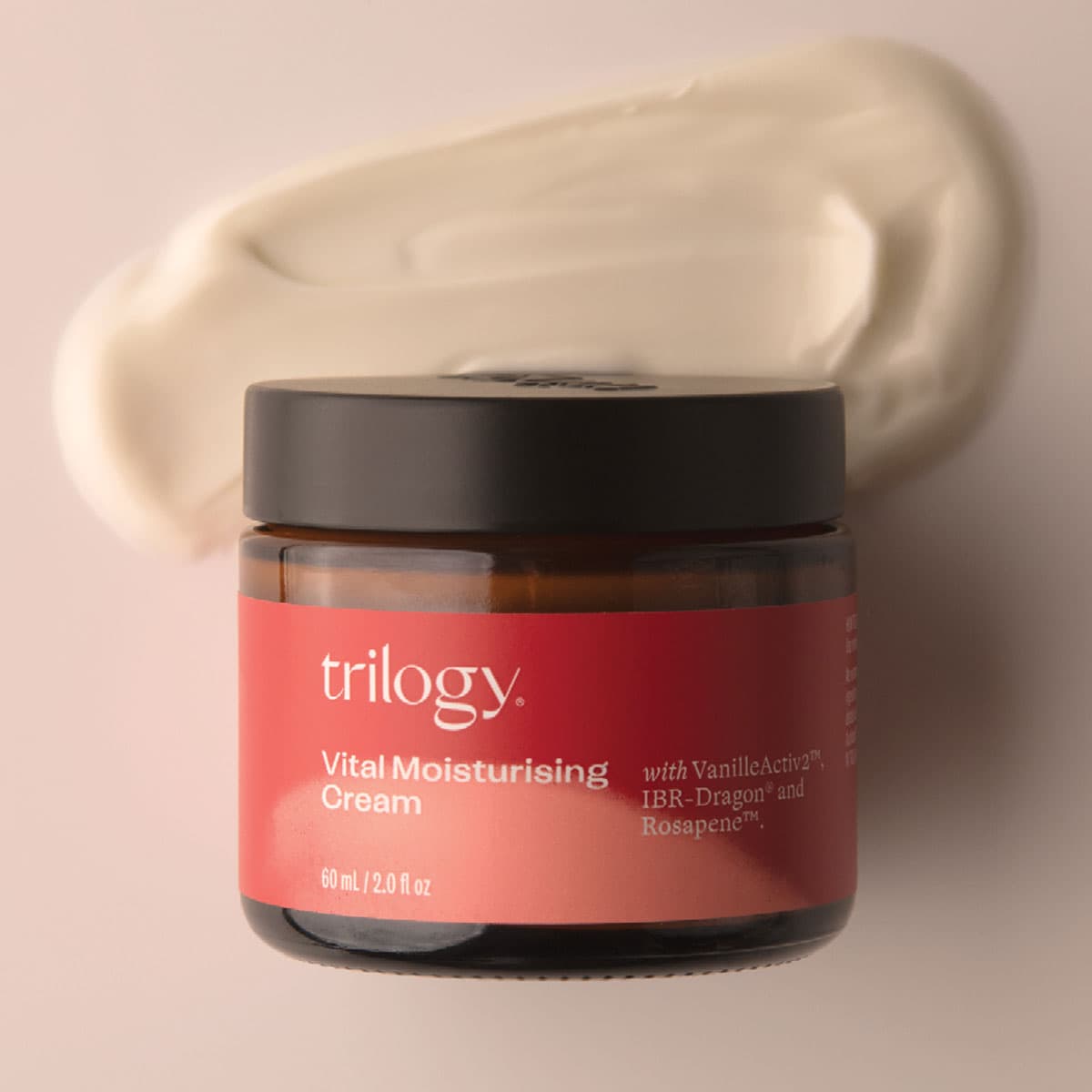 Jar of Trilogy Vital Moisturising Cream with cream swatch on beige background.