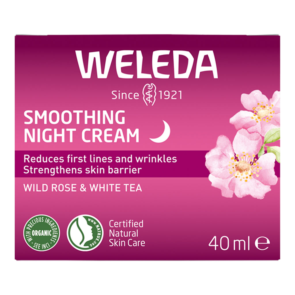 Weleda smoothing night cream packaging with pink background and floral design.